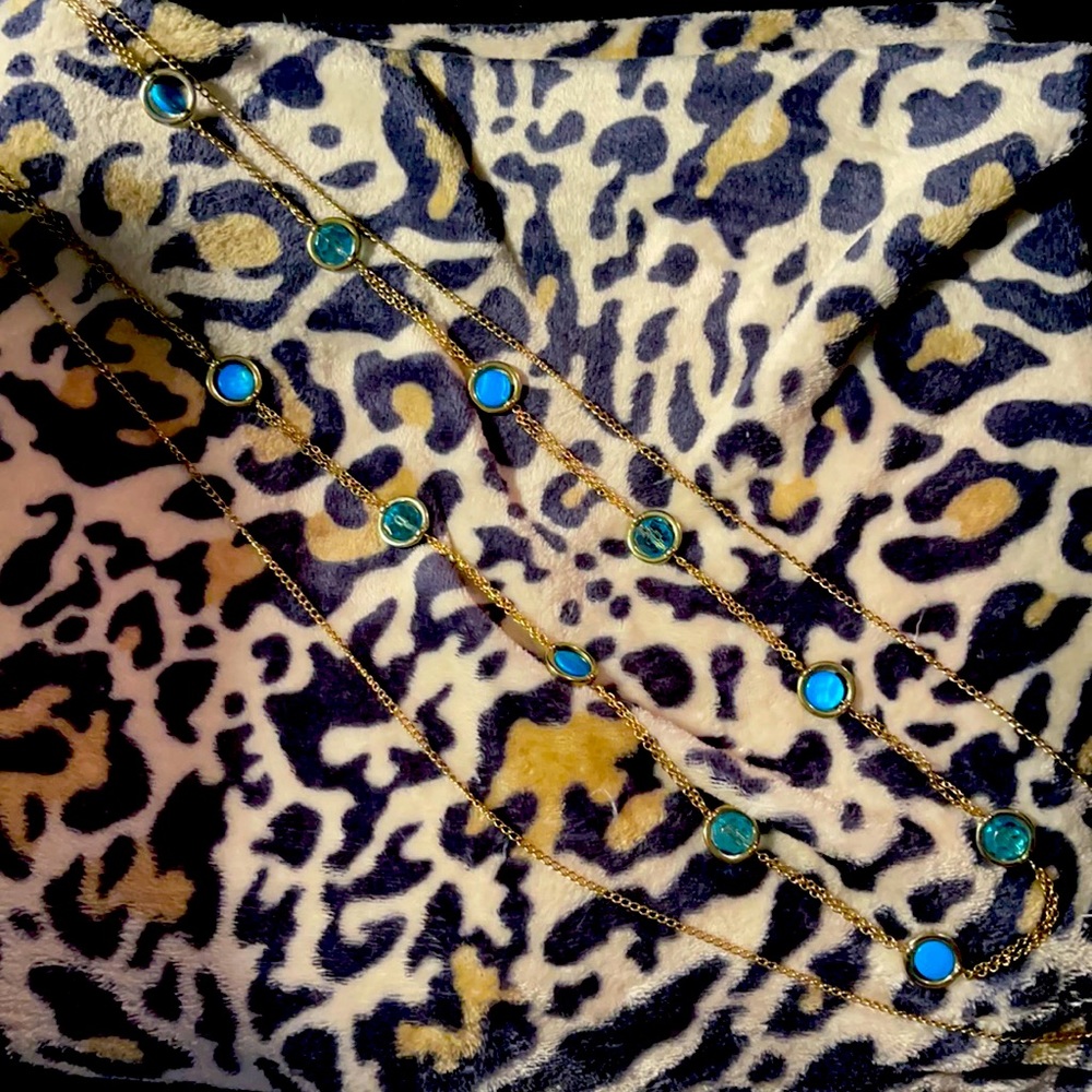 Gold necklace a blue and teal sounds